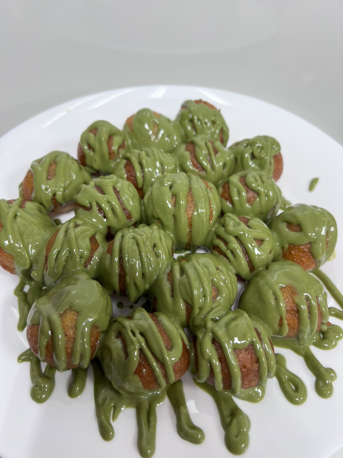 Loqaimat with pistachio sauce